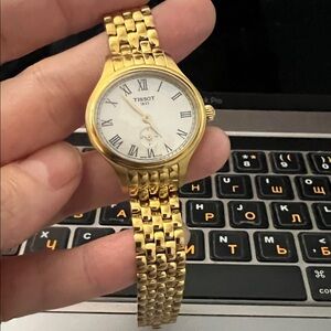 Tissot Gold Tone Watch with White Dial